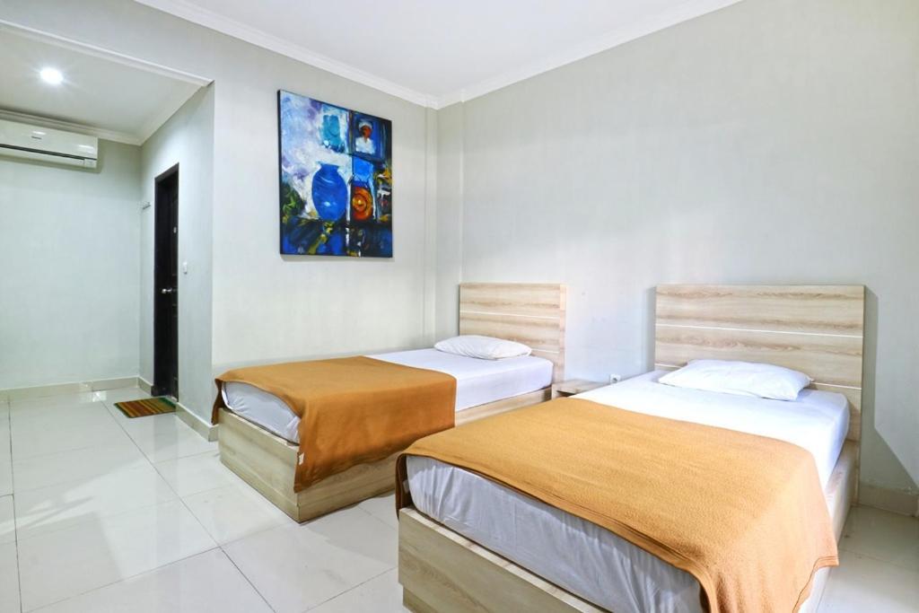 Palm Garden Kuta Hotel Кута Екстериор снимка