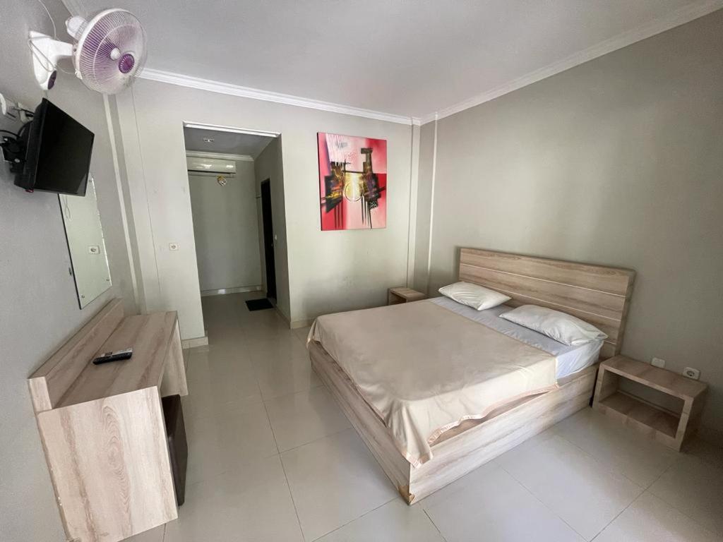 Palm Garden Kuta Hotel Кута Екстериор снимка